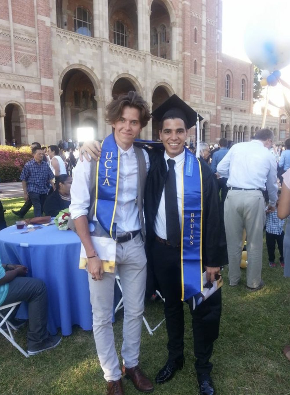 Yvan Alix Levy in cap and gown at his UCLA graduation in 2015, in front of Royce Hall